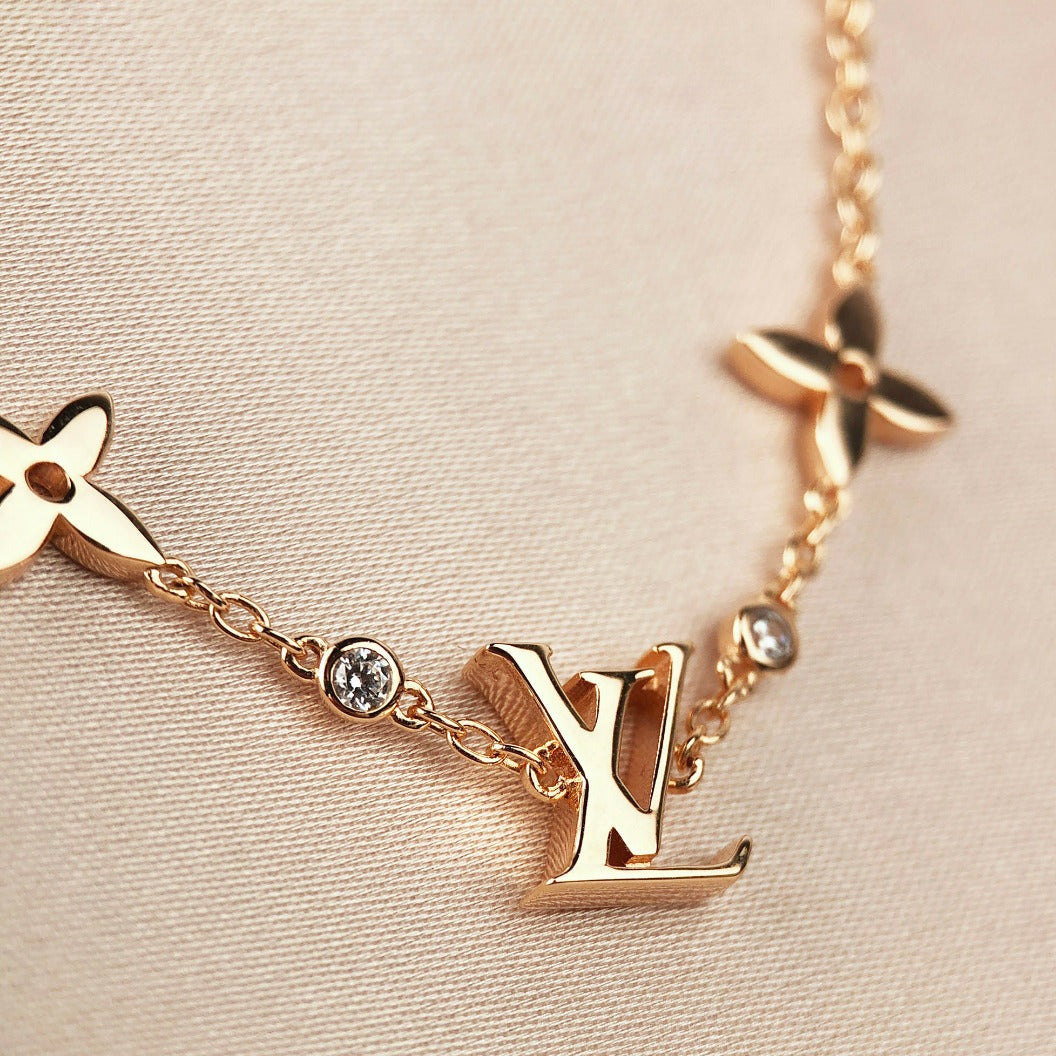 Miro STAR AND SUN 7 MOTIFS GOLD BRACELET