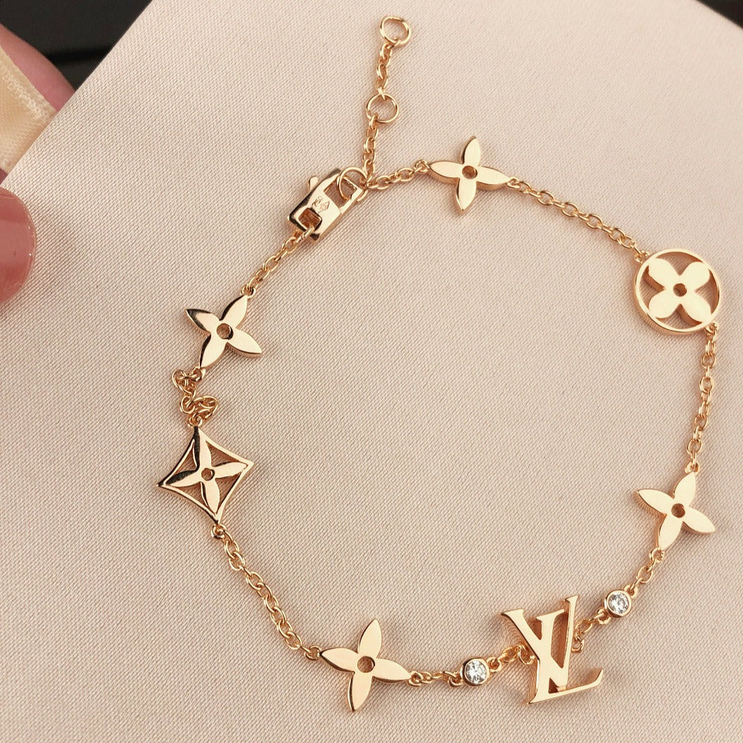 Miro STAR AND SUN 7 MOTIFS GOLD BRACELET