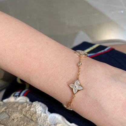 Miro STAR AND SUN 4 MOTIF WHITE MOP PINK GOLD BRACELET
