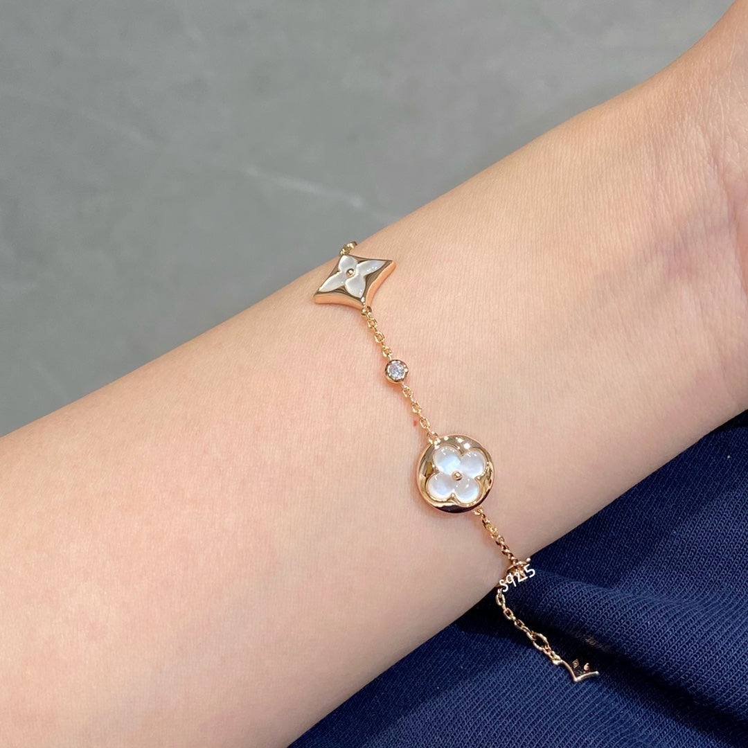 Miro STAR AND SUN 4 MOTIF WHITE MOP PINK GOLD BRACELET