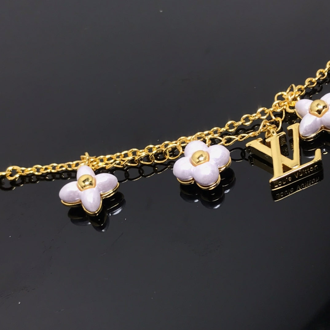 Miro LOGO 6 MOTIF STAR AND SUN GOLD BRACELET